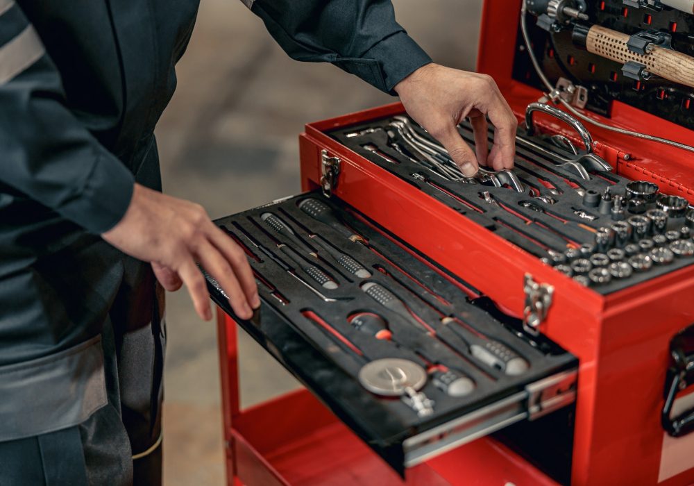 male-mechanic-using-tool-box-in-hangar.jpg